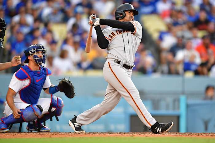 SF Giants first baseman LaMonte Wade Jr. hits a three-run home run against the Los Angeles Dodgers in the fifth inning at Dodger Stadium on June 17, 2023.